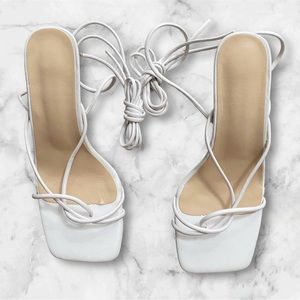 White sandals, medium heel